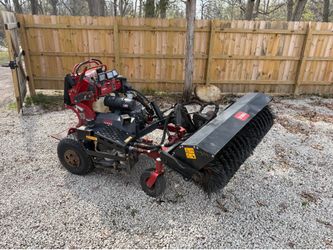 Toro multiforce with broom attachment and mower deck