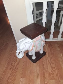 And terracotta elephant plant stand