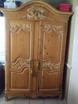 7 feet 4 inches HIGH X 4 feet 7 inches wide ARMOIRE Very tall armoire. Nice honey light color.
