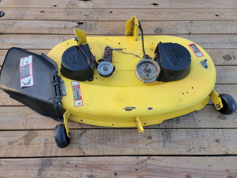 John Deere 42" riding mower deck. New bearings and new blades. fits D, E and S models. Clean. working. 