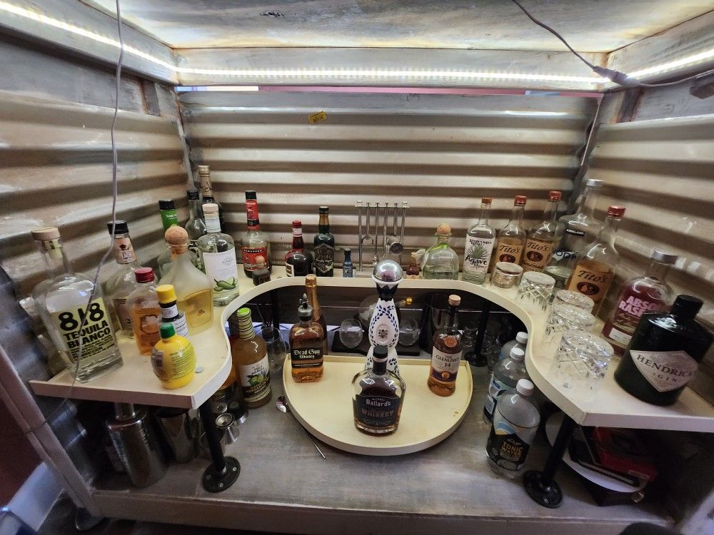 Custom Made Bar With Stools And Decor