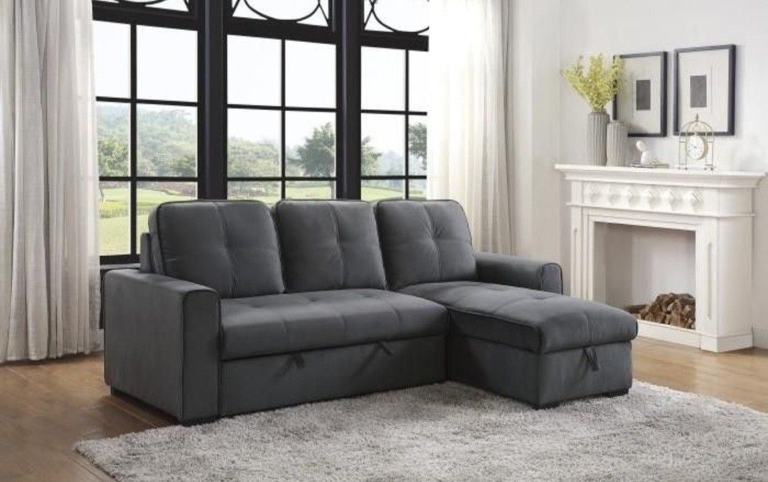 50% SALE 2 piece reversible sectional with storage and sleeper