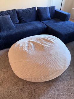 White bean bag love seat with queen mattress inside
