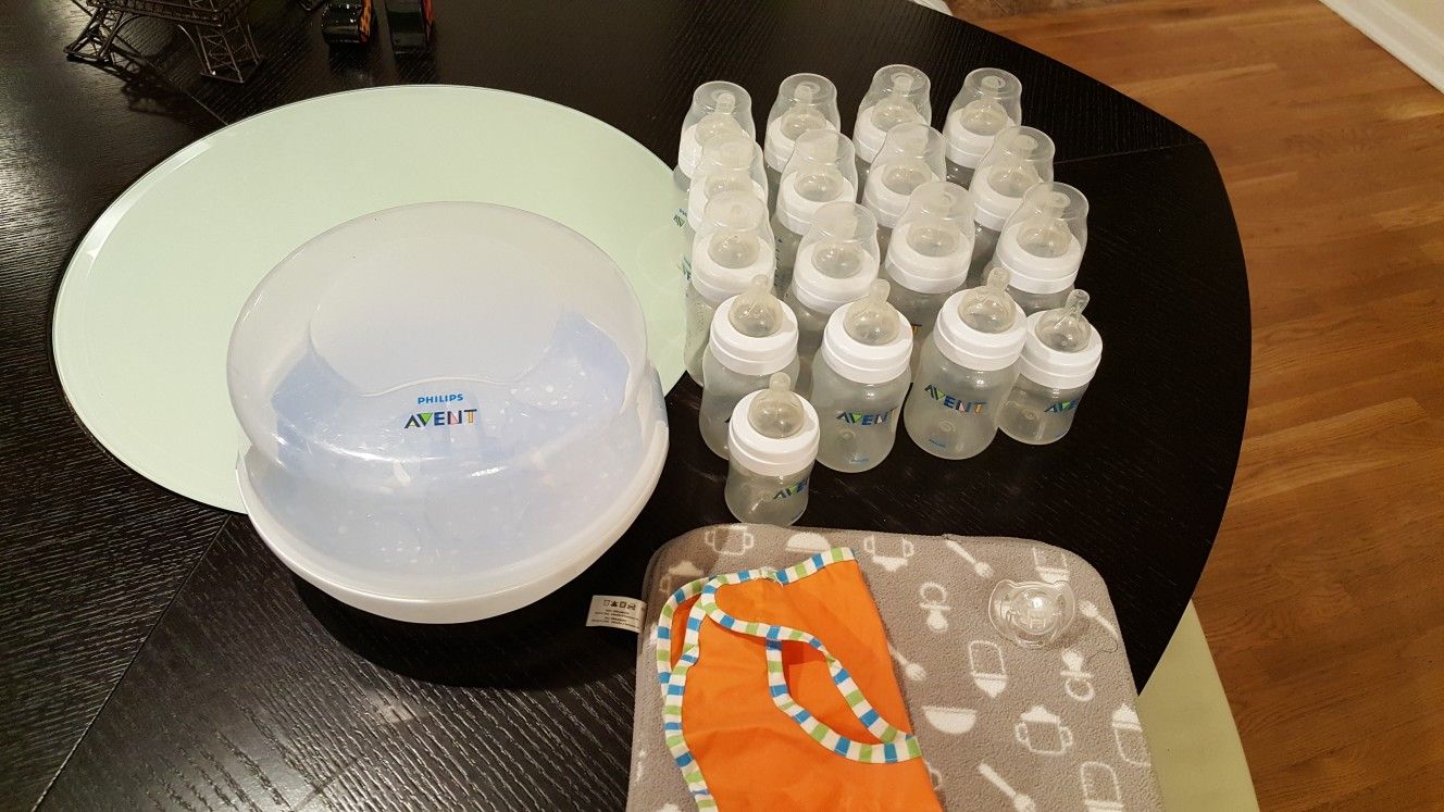 17 avent bottles, sterilizer and drying mat