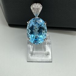 Blue Topaz And Diamond Pendant 