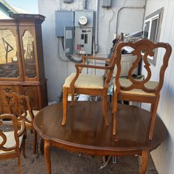 Kitchen dinner table and plate storage.