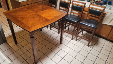 Counter height dining table and bar stools
