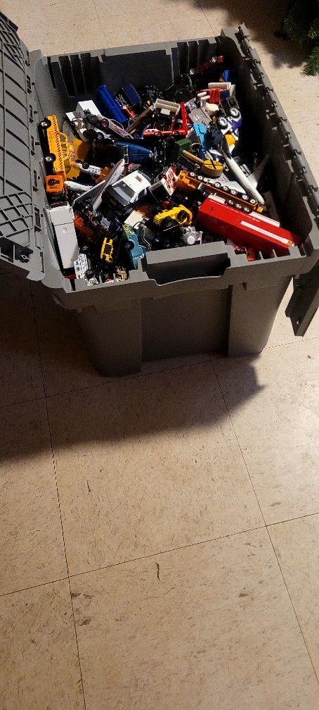 A Container Of Car Toys For All Ages