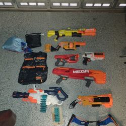 Multiple Nerf Guns, Including Various Accessories And Extra Darts