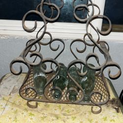 Wrought iron caddy holder with  4 Vintage Coca-Cola bottles