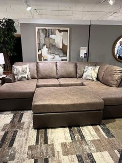 Sleek Large Sectional features double Chaise & contrasting rich brown finish