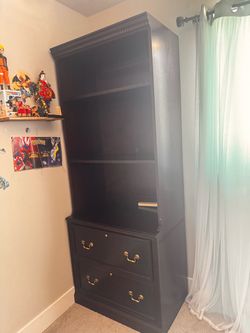 Free Dark warm brown Bookcase with Drawers