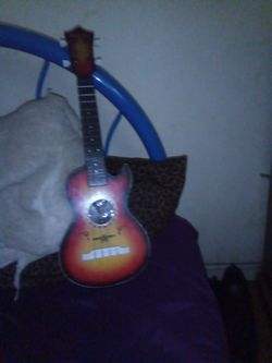 Four string guitar