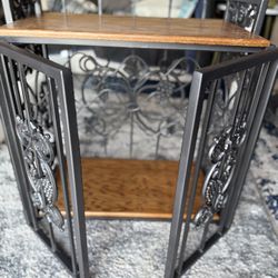 decorative wine rack or wine cabinet with a grape and vine motif. 