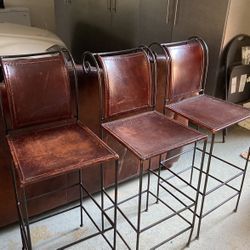 3 matching iron and leather barstools. Nice!