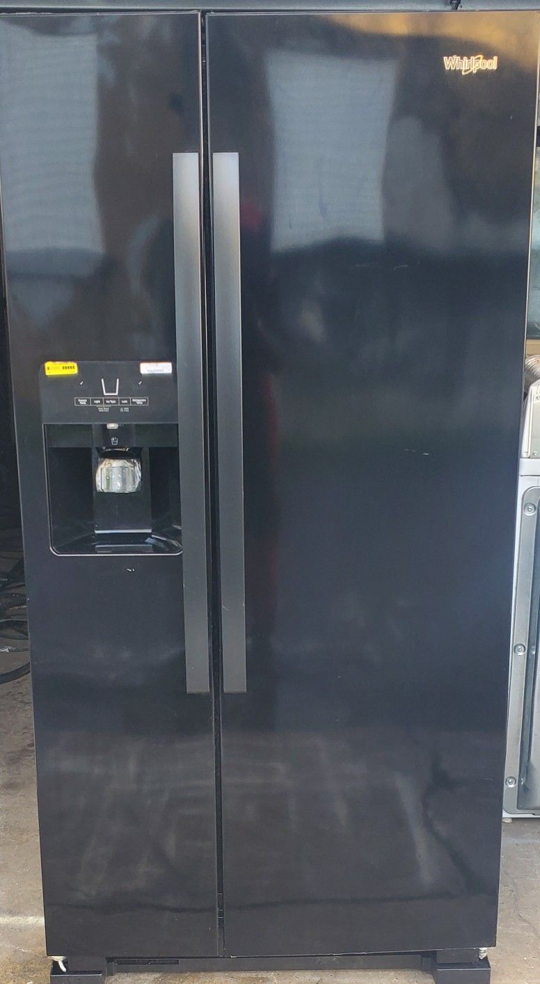 3 year old Whirlpool 22 cubic feet shiny black side by side refrigerator, with filtered water dispenser, icemaker. Model#WRS321SDHB01.