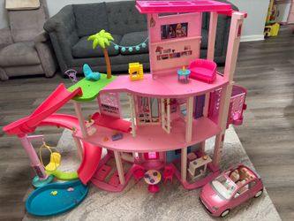 Barbie dream house (pool party edition) with accessories & dolls.