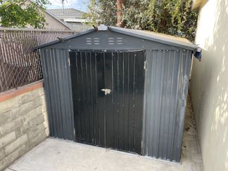 Veikous 8 ft W x 12 ft D metal storage shed in good reusable condition