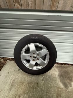 Four Acura wheels rim size 6 1\2 tire size 215/70R16