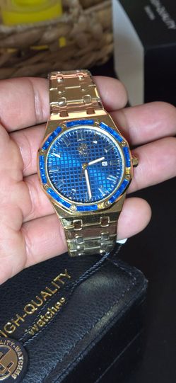 VIP Gold-Tone Luxury  Watch with Blue Crystal Bezel.