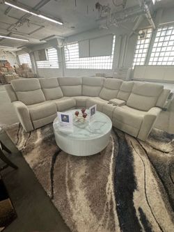 Grey manual reclining sectional comes in black