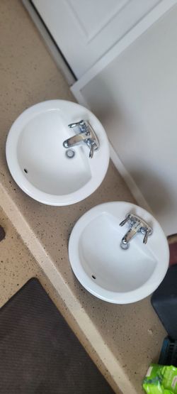 white sink with foucets