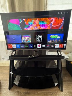 Lg 43” UQ7070ZUD smart tv and entertainment center(table)