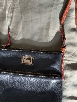 Dooney & Bourke navy blue leather crossbody bag with pebbled texture