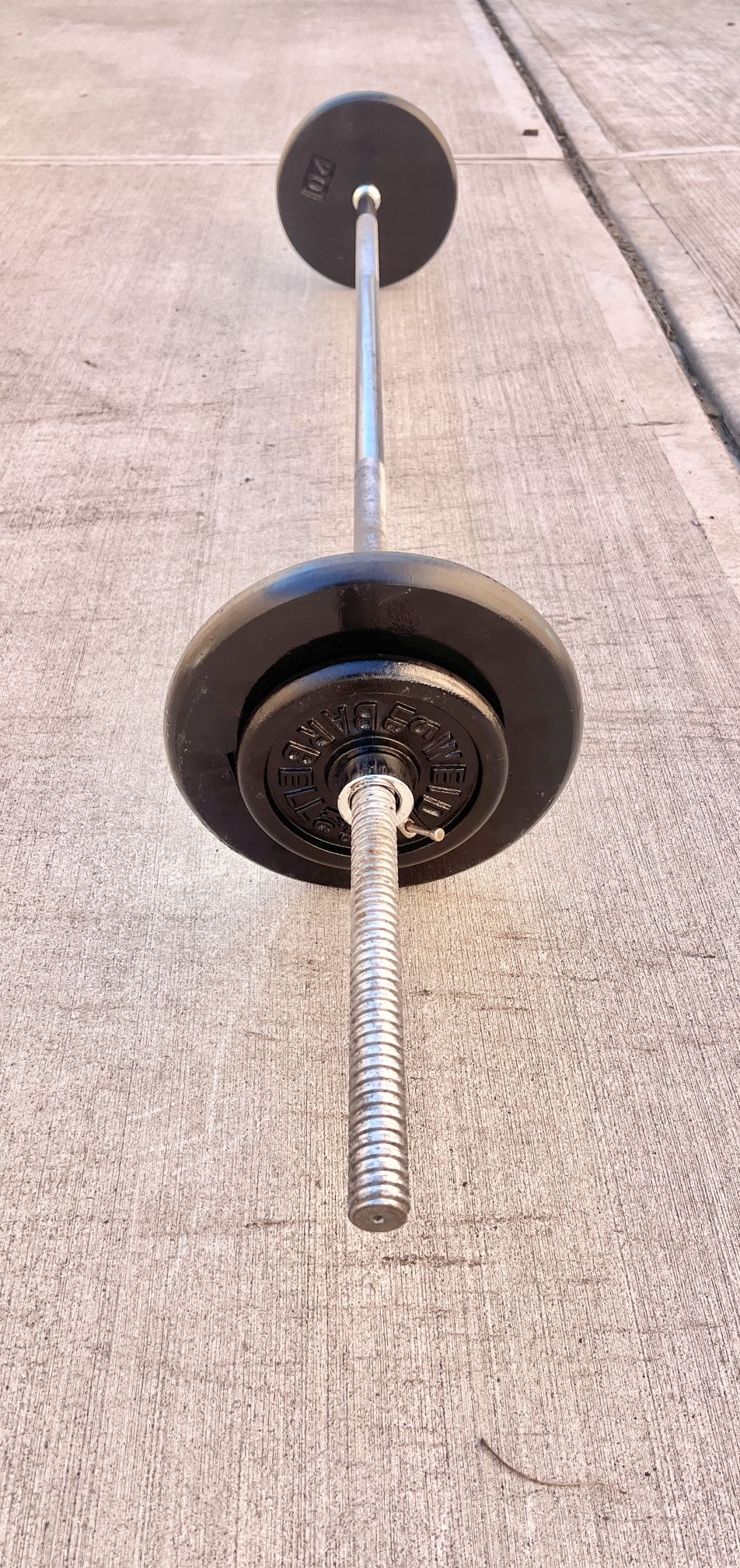 Barbell Bar ..plus Weights 50 lbs…I’m Located In Bayside Queens