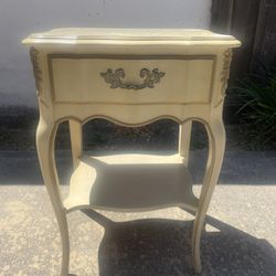 Antique cream-colored side table