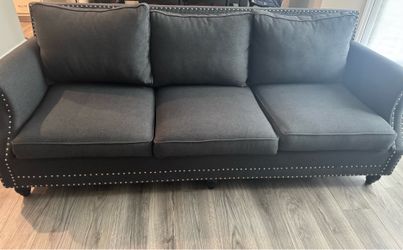 Gray studded couch