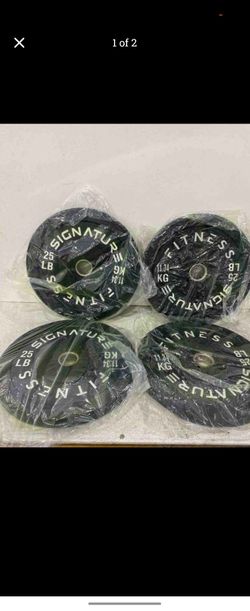 Signature fitness 25# bumper plates Olympic size.