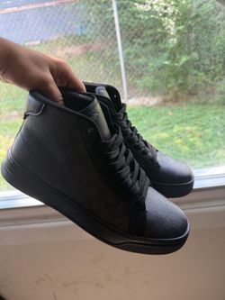 Black high top coach shoes