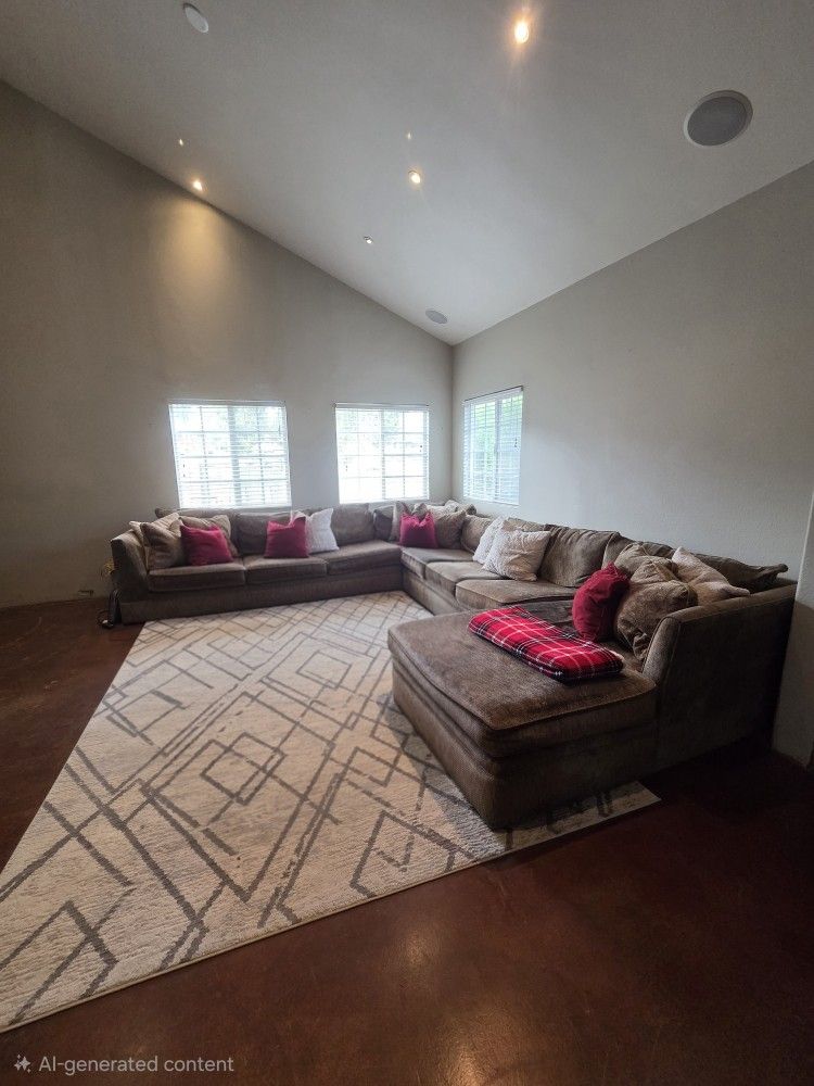 Couch W Pillows And Area RUG