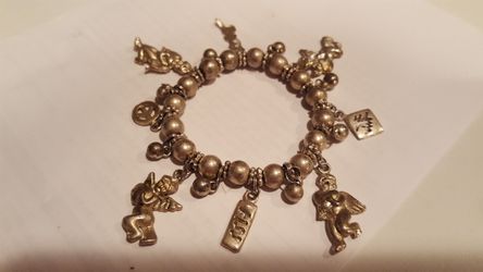 Brand new silver bracelet with charms