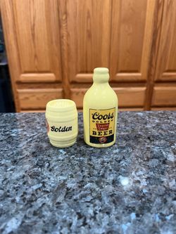 Vintage Ceramic Coors Golden Beer Export Lager And Keg Salt and Pepper shakers.  Size tallest is 3 1/2 inches tall.  Preowned stoppers have been repla