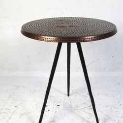 Unique Side Table In The Boho Chick Style With The Hammered Copper Finish Top And Black Tripod Legs H24” And 18”In Diameter 