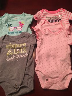 Onesies a total of 9 size 0-3 Mos