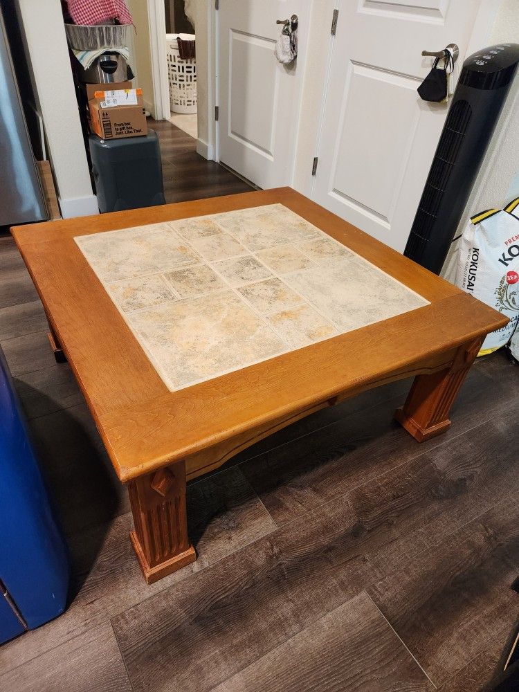 coffee table
tile inlay, wood base
42x42x18H"
sturdy
$50