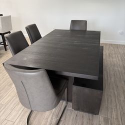 Dining table with 4 chairs and a bench, TV Console, and bookshelf