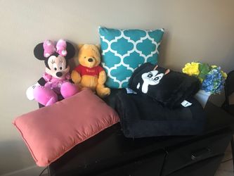 Sofa pillows and floppy plush toys