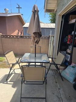 Table with umbrella 4x chairs
