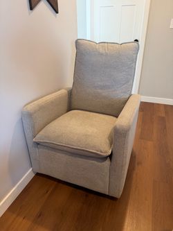 Swivel rocking chair.