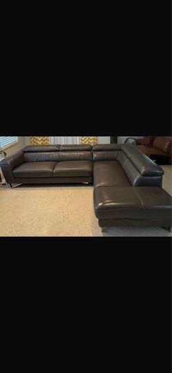 Dark gray genuine leather sectional sofa. Normal signs of use and wear. Asking $275 OBO (or best offer).
