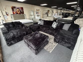 Midnight Sectional U Shape $1599. Ottoman $349. Oversize Chaise $999. Delivery Available 