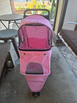 Pink pet stroller