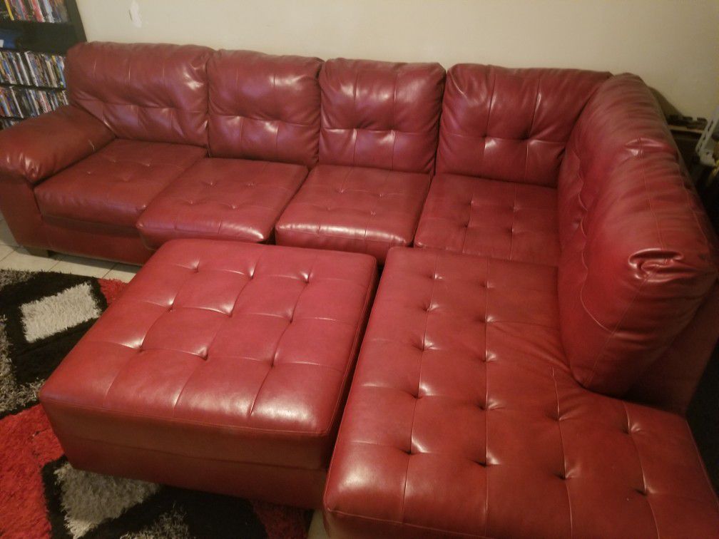 Red Leather Couch with Ottoman & Rug