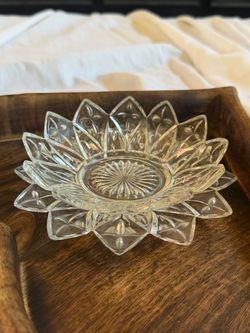Clear pressed glass flower-shaped dish