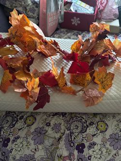 Bright faux maple leaf garland in orange and red. Adds instant autumn warmth to mantels, doorways, and tables. Flexible, lightweight design for easy s