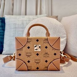 MCM VISETOS SMALL TRUNK BAG IN BROWN